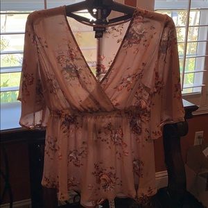 Torrid brand mauve/floral baby doll blouse size 00